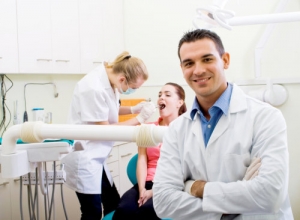 two dentists in the clinic and patient